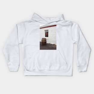 Wine barrel in front of window. Kids Hoodie